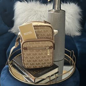 Brand new, never used Michael Kors camera crossbody. Medium size, tan- canvas